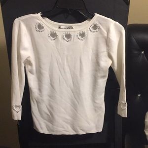 White top with cut our hearts